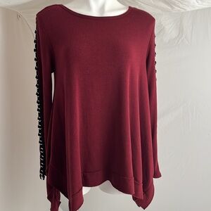 Ariella brick red peek-a-boo long sleeve swingy top